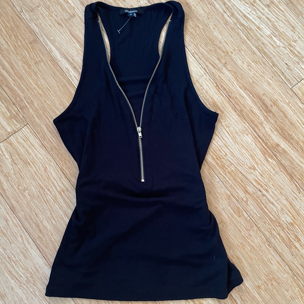 Black Tank top with gold zipper, zipping neckline into a deep V neck. Brand New.